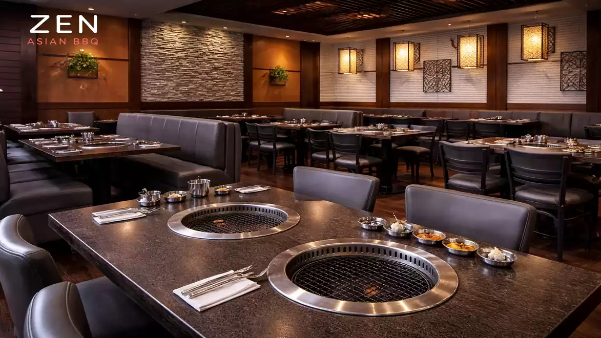 An elegant Asian restaurant featuring modern tabletop grills and stylish interior design.