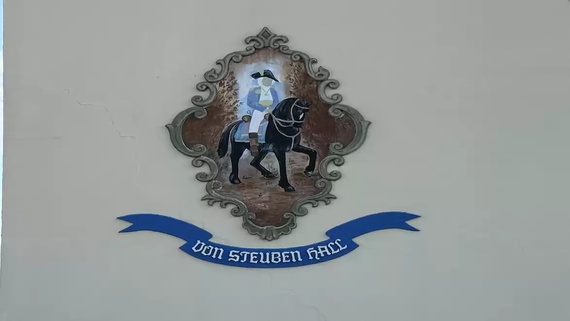 Image of a mural featuring a rider on a black horse with the inscription 'Von Steuben Place'.