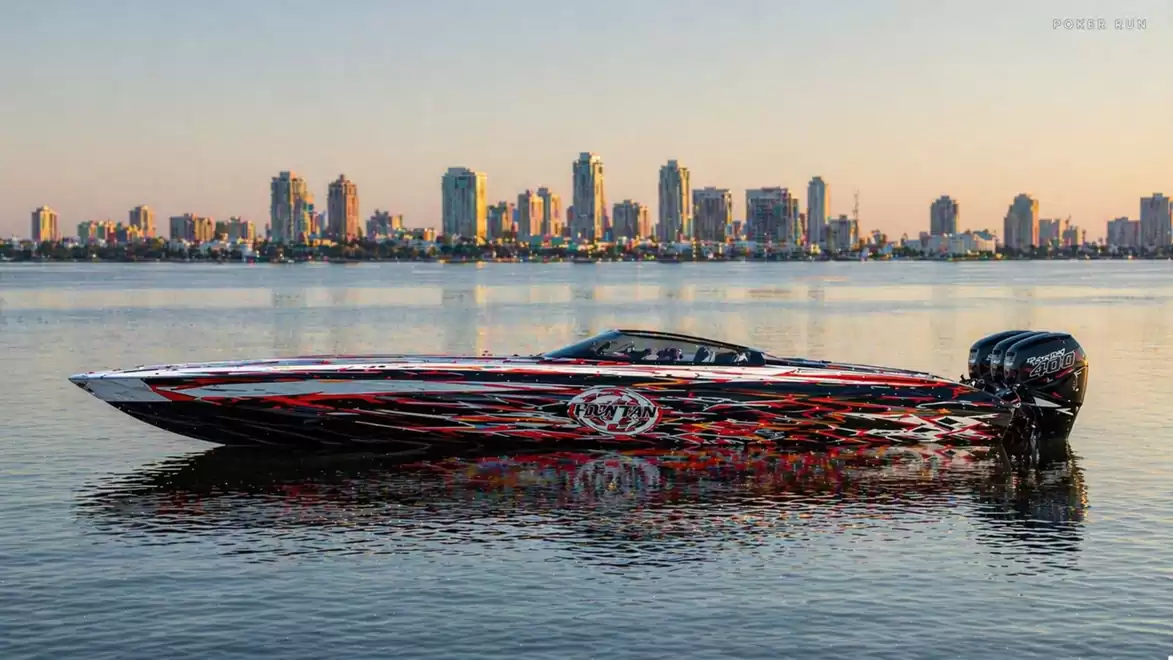 A sleek speedboat with stylish design cruises over calm waters, set against the backdrop of a modern city at sunset.