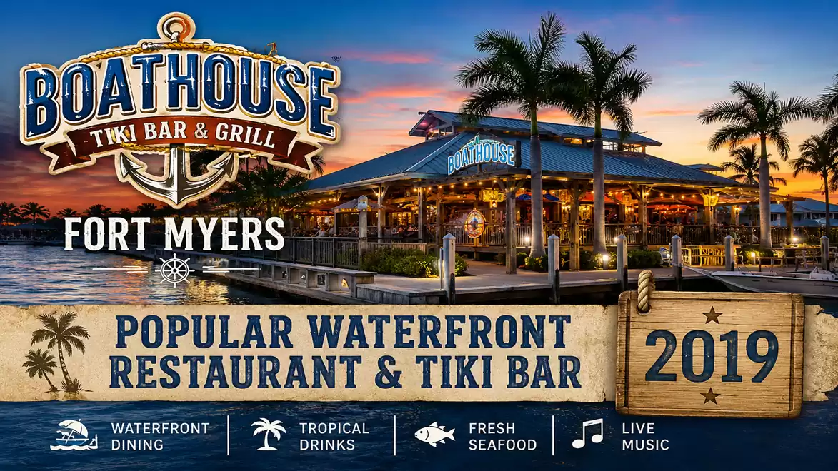 Image of Boathouse Tiki Bar & Grill by the water in Fort Myers with illuminated building at sunset, featuring text promoting popular waterfront restaurant.