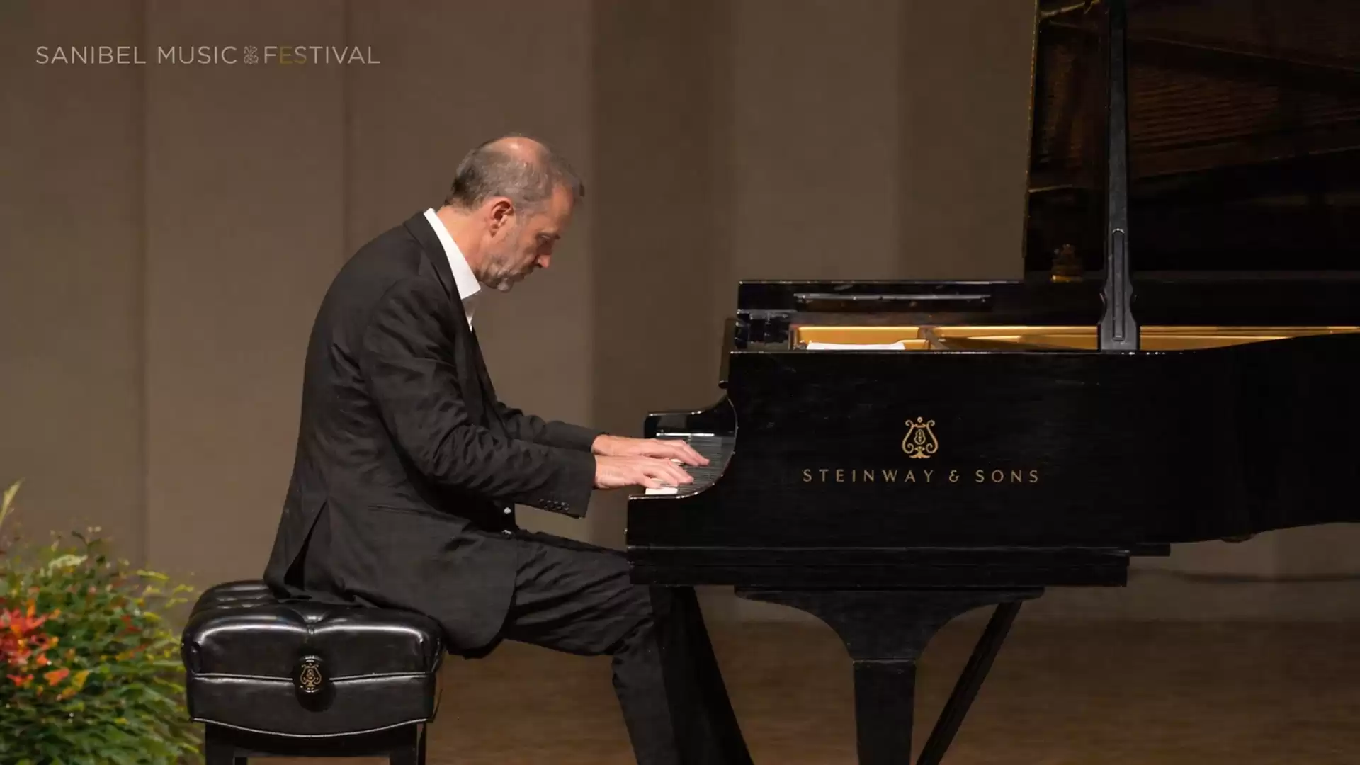 A pianist plays on a black Steinway & Sons grand piano during a concert at the Sanibel Music Festival.