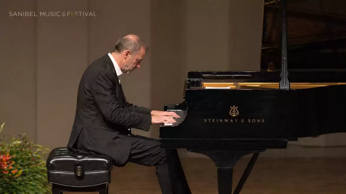 A pianist plays on a black Steinway & Sons grand piano during a concert at the Sanibel Music Festival.
