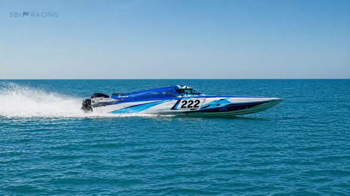 Fast speedboat with the number 222 on open water.