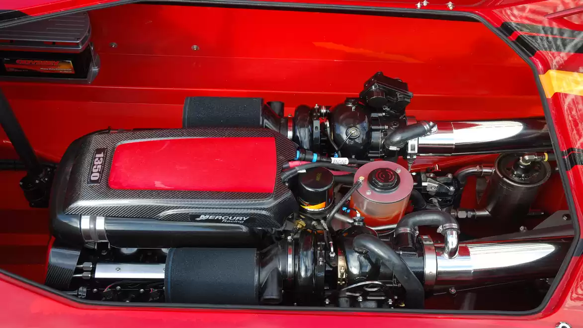 Close-up of a powerful sports car engine with a red casing.
