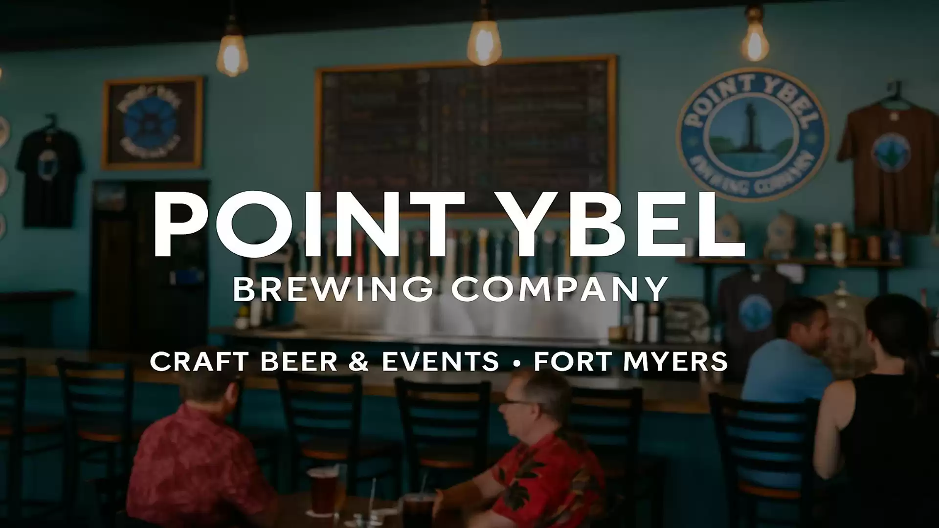 Interior of Point Ybel Brewing Company with bar and guests in Fort Myers.