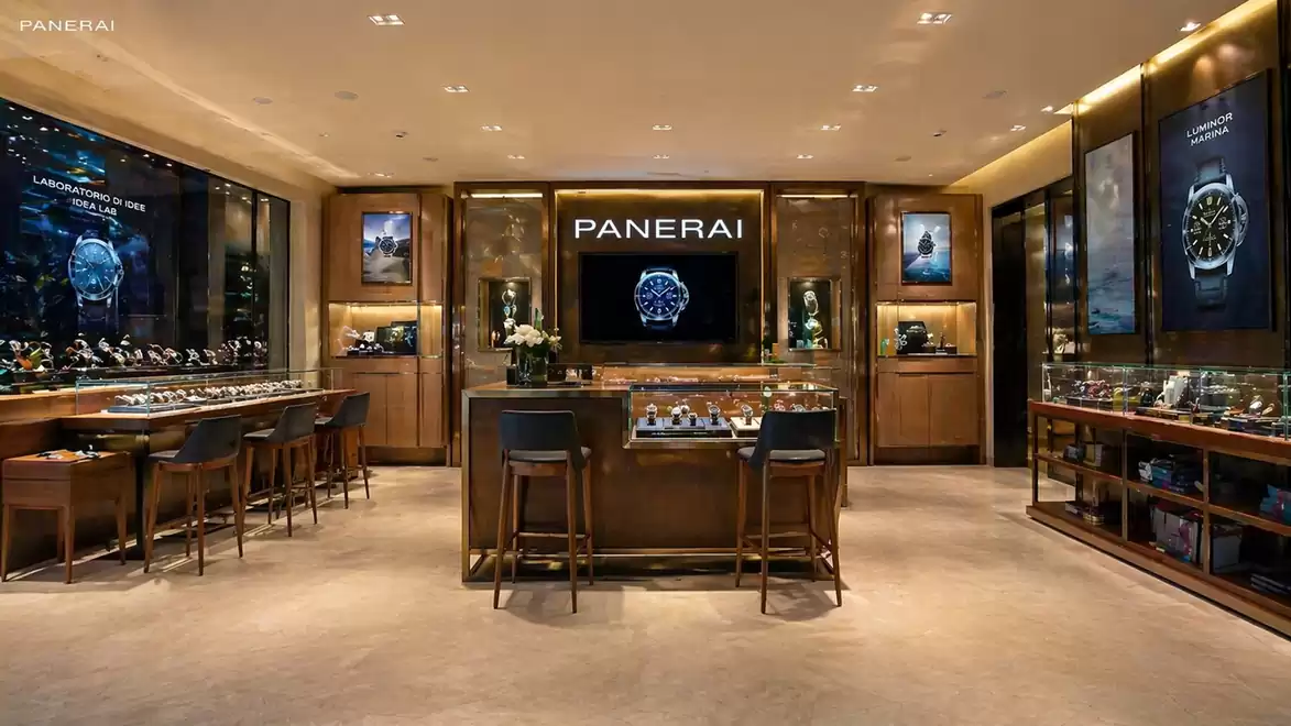 Interior view of a luxury watch store with elegant decor and watch displays.