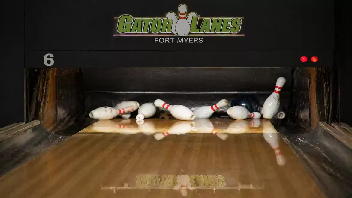 Fallen bowling pins on a lane at Gator Lanes in Fort Myers.