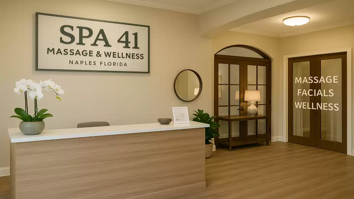 Interior view of a wellness spa with modern design, front desk, orchid, and inviting atmosphere at Spa 41 in Naples, Florida.