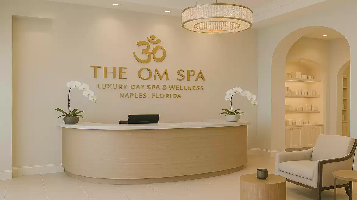 Elegant reception area of a luxury day spa with subtle lighting, golden lettering, and orchids.