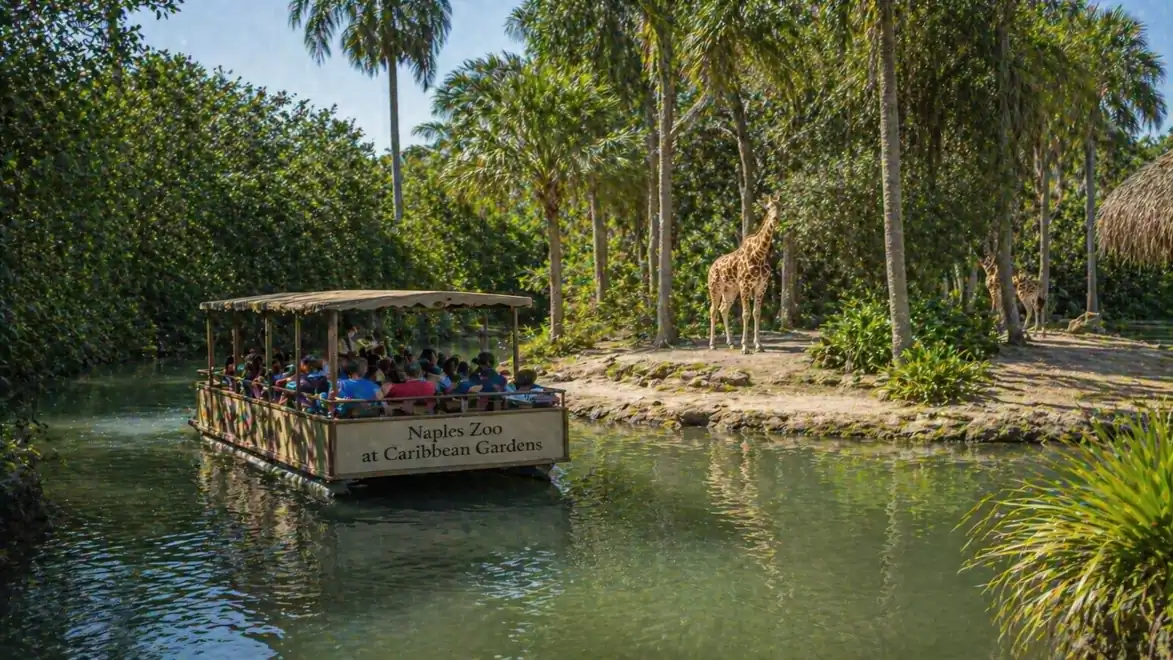 Boat tour in Naples Zoo with visitors observing giraffes in a tropical setting.
