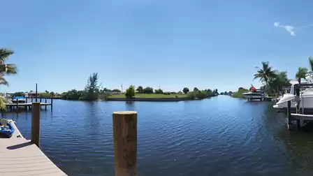 Located on the bend of a canal, the home offers spectacular water views in two directions