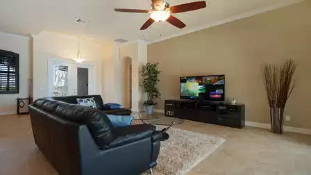 The living room offers a large flat screen TV