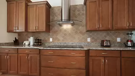 From the hood to the spice rack - absolutely nothing is missing in this kitchen