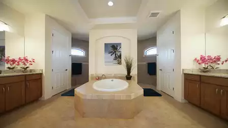 Both tub and shower can be found in the adjacent master bath