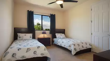 Two Twin beds are set up in this bedroom
