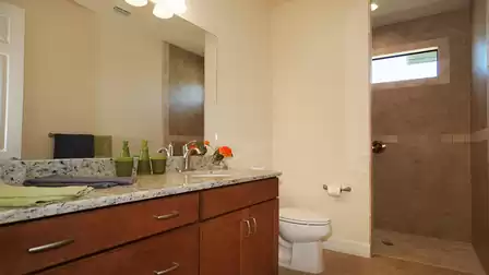 The second bathroom features a walk-in shower