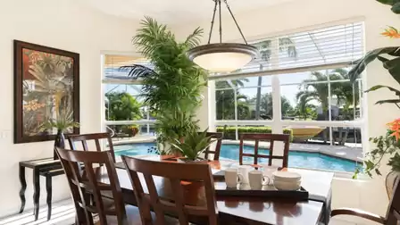 The light and bright dining room overlooks the pool area