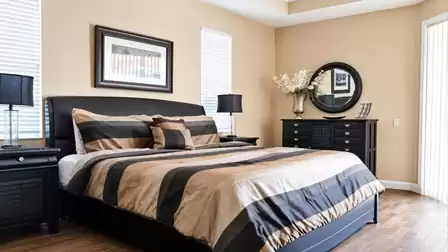 The master bedroom offers a King size bed and access to the patio