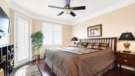The second bedroom also offers a King size bed and access to the pool area