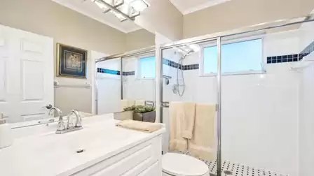 The second bathroom features a shower