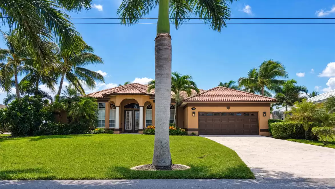 Palm trees surround the villa and provide shade