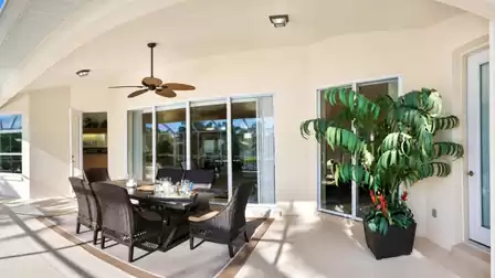 Enjoy your meals right by the pool on the covered patio