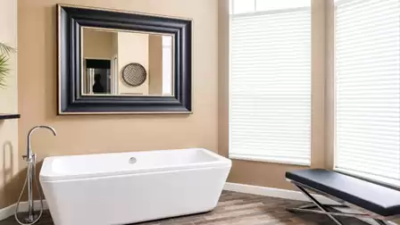 The white modern bathtub invites you to relax with a glass of sparkling wine hmmm