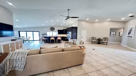 View from the living room into the open kitchen and dining area. Bright, inviting atmosphere for your vacation days