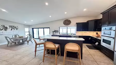 View of the modern kitchen and dining area.