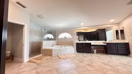 The adjacent master bath offers tub, shower and double sinks
