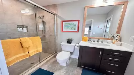 The second bathroom serves also as pool bath