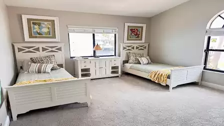 The inviting fourth bedroom features two Twin beds