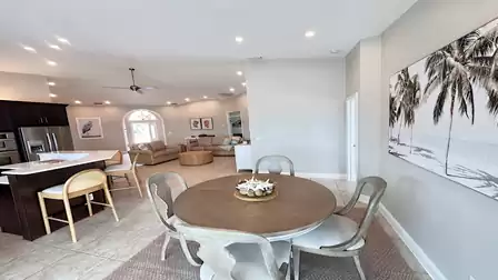 View from the dining area into the kitchen and living room