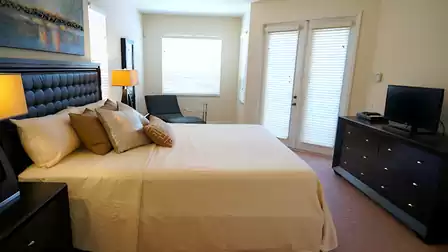 French doors lead out to the pool area