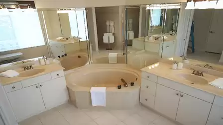 The master bath offers a tub and two separate sinks