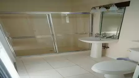 The second bathroom features a shower