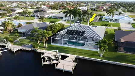 View from above of the villa, the canal and the boat dock