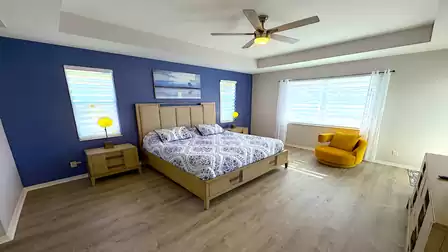 Bright, light-flooded master bedroom