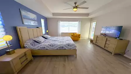 A door provides access from this bedroom to the patio
