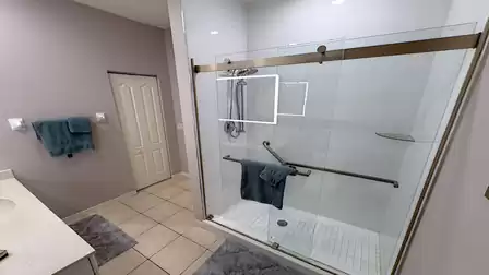 Has a toilet, washbasin and a large shower