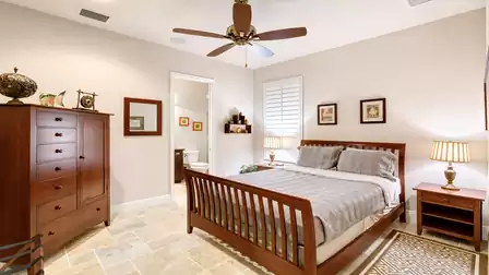 A Queen size bed is set up in the second bedroom