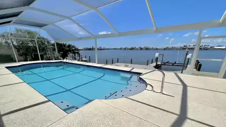 The large electrically and solar-heated pool promises refreshing hours of swimming