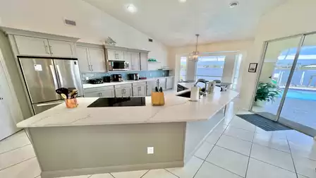 View of the large kitchen with modern stainless steel appliances