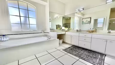 Large bathroom with bathtub and full-length mirror front