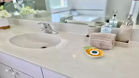 One of the two sinks in the master bathroom