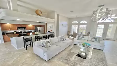 Large windows and high ceilings make the living area light and airy