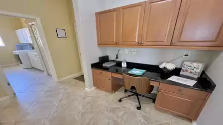 Next to the kitchen is a small office area