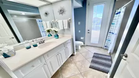 The second bathroom with sink, shower and toilet
