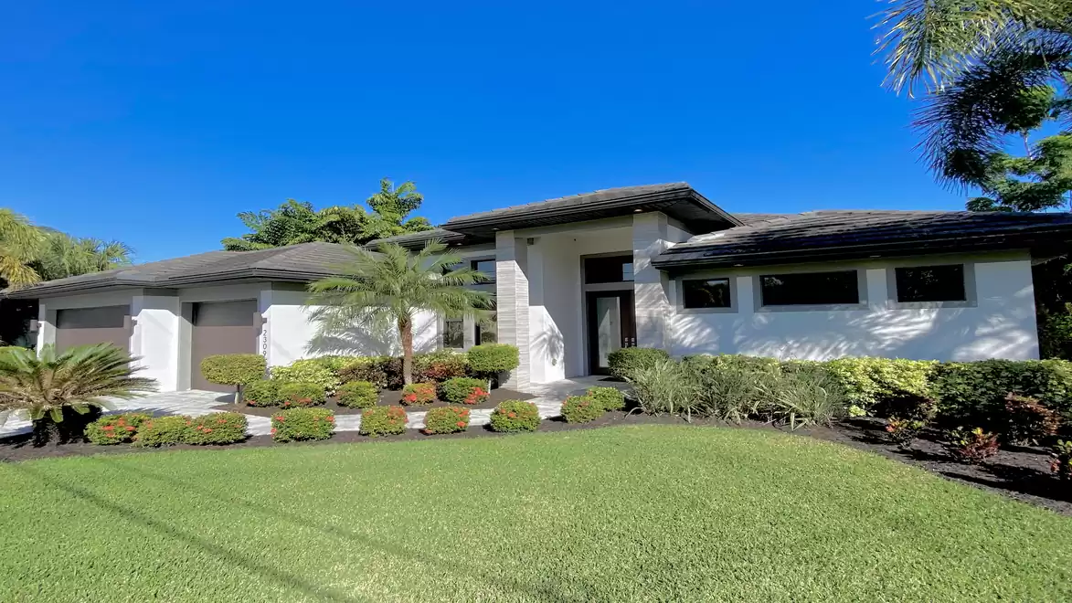 Manicured landscaping surrounds the property