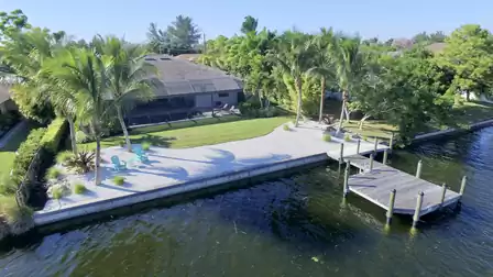 View from the canal to the beach and the garden of Villa Pandora
